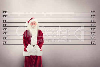 Composite image of jolly santa smiling at camera