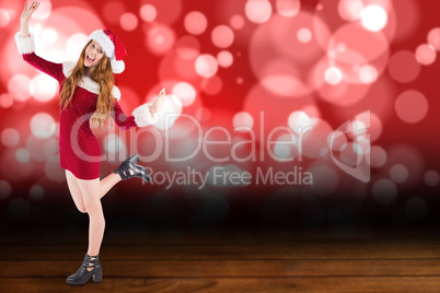 Composite image of festive redhead smiling at camera