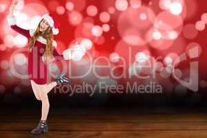 Composite image of festive redhead smiling at camera