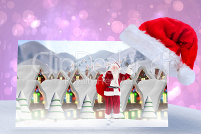 Composite image of santa delivery presents to village