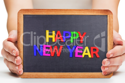 Composite image of females hands showing black board