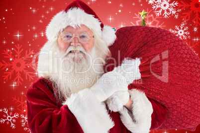 Composite image of jolly santa carries his sack