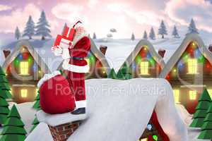 Composite image of santa on cottage roof