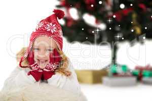 Composite image of festive little girl in hat and scarf