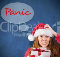 Composite image of festive stressed redhead holding gifts