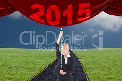 Composite image of businesswoman pulling a chain