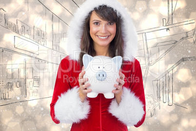 Composite image of smiling brunette in santa claus holding a pig