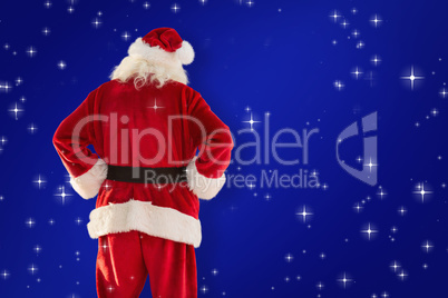 Composite image of rear view of father christmas