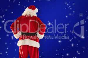 Composite image of rear view of father christmas