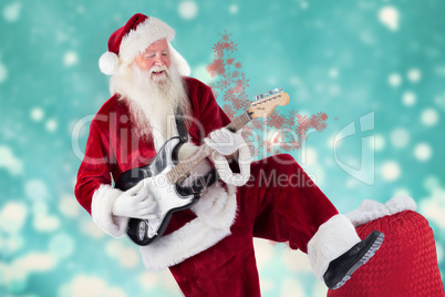 Composite image of santa claus has fun with a guitar