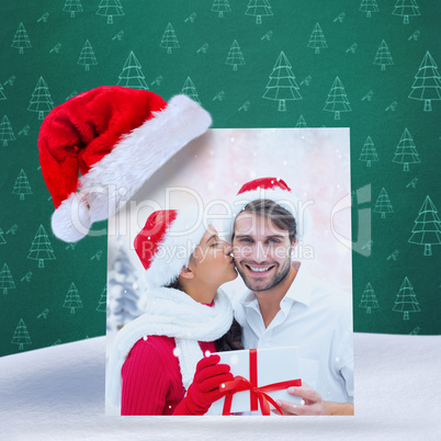 Composite image of festive young couple holding gift