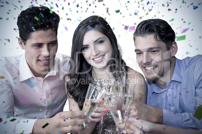 Composite image of friends toasting with champagne