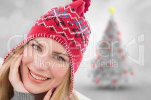Composite image of smiling woman wearin hat