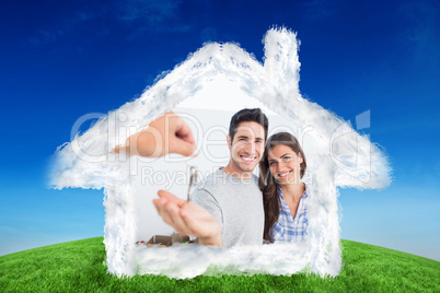 Composite image of happy man being given a house key