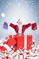 Santa standing in large gift