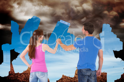 Composite image of couple painting a wall together