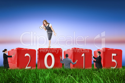 Composite image of businesswoman shouting through megaphone