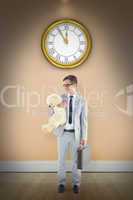 Composite image of businessman holding teddy bear