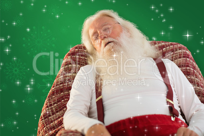 Composite image of father christmas sleeps on the armchair