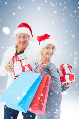 Couple with shopping bags and gifts