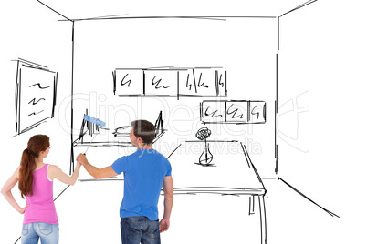 Composite image of couple painting a wall together