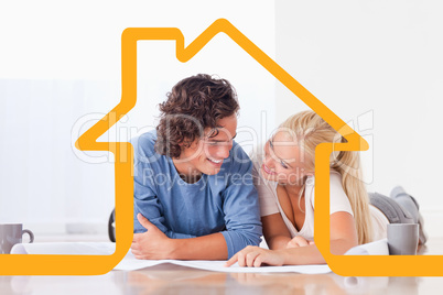 Composite image of smiling couple moving in a new house