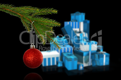 Composite image of red christmas bauble hanging from branch