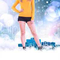 Composite image of lower half of woman in boots and shorts