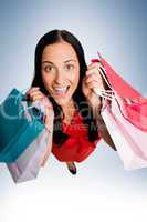 Woman standing with shopping bags