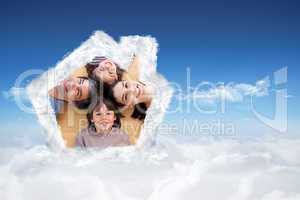 Composite image of smiling young family lying on the floor with