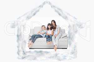 Composite image of mother with their children sitting on sofa