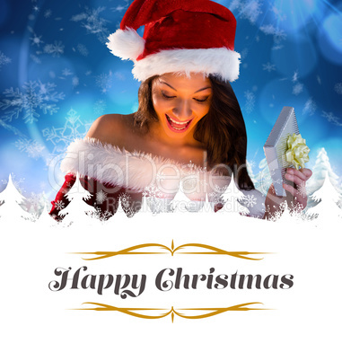 Composite image of sexy santa girl opening gift