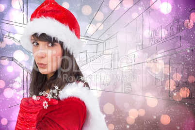 Composite image of pretty girl in santa costume holding hand out