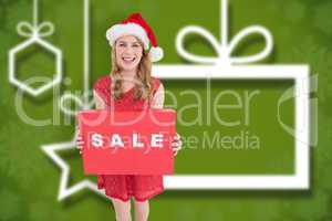 Composite image of smiling woman in santa hat holding box