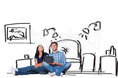 Composite image of young couple sitting on floor with tablet