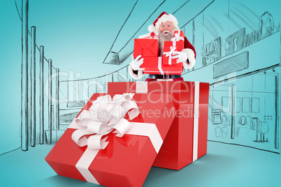 Composite image of santa standing in large gift