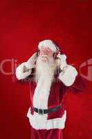 Composite image of santa claus enjoys some music