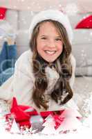 Composite image of festive little girl smiling at camera