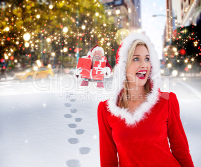 Composite image of festive blonde looking to the side