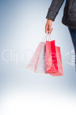 Smiling woman holding shopping bag