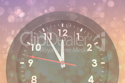 Composite image of clock counting down to midnight