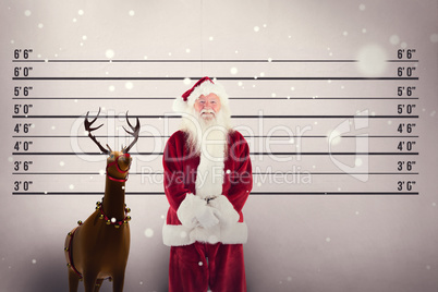 Composite image of jolly santa smiling at camera