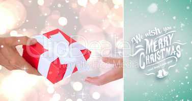 Composite image of couple holding gift