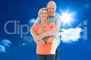 Composite image of happy older couple holding paint roller