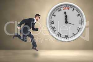 Composite image of geeky young businessman running mid air