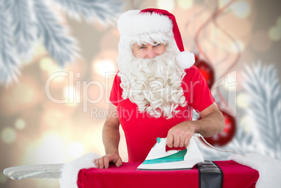 Composite image of happy santa claus ironing his jacket