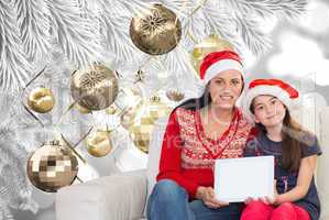 Composite image of mother and daughter showing tablet