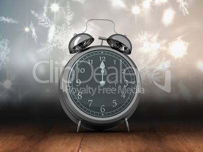 Composite image of alarm clock counting down to twelve