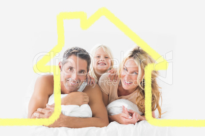 Composite image of family posing lying on a bed