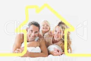 Composite image of family posing lying on a bed